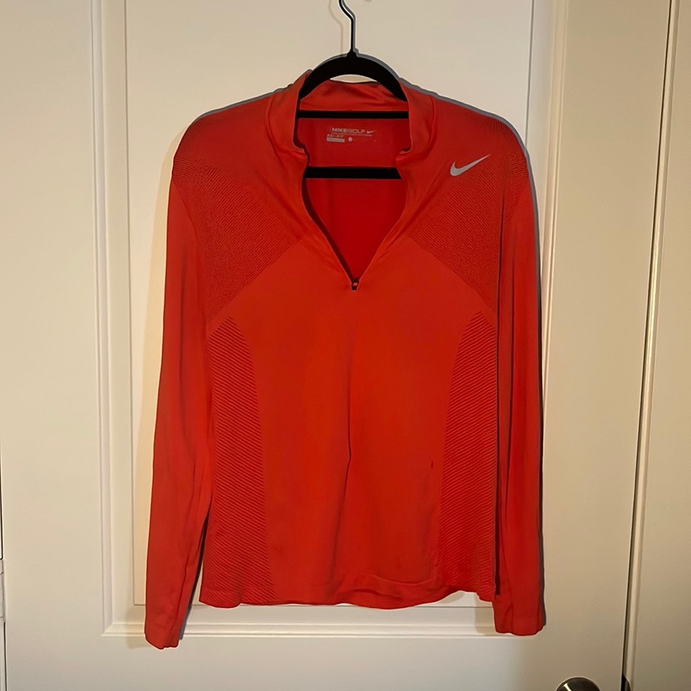 Red dry fit top. Women’s large but fits like a unisex small would.